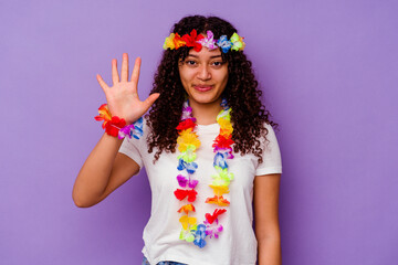 Young Hawaiian woman isolated on purple background smiling cheerful showing number five with fingers.