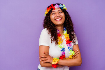 Young Hawaiian woman isolated on purple background laughing and having fun.