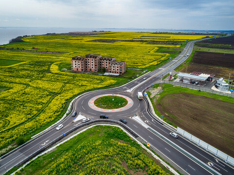 Top View Of The Road With A Circular Motion And A Flower Bed. Aerial Photography.