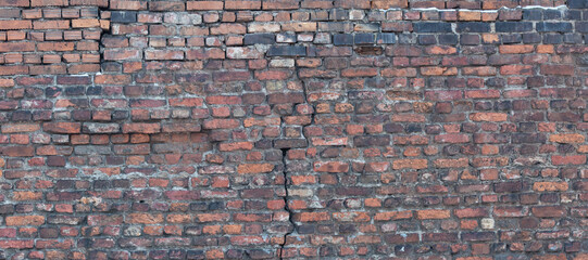 crack in old orange bricks wall