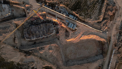 Large construction site. Construction of multi-storey buildings has begun. Tower cranes are standing. Aerial photography of construction.