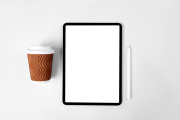 iPad pro with white screen on pink color background. Flatlay. Office background
