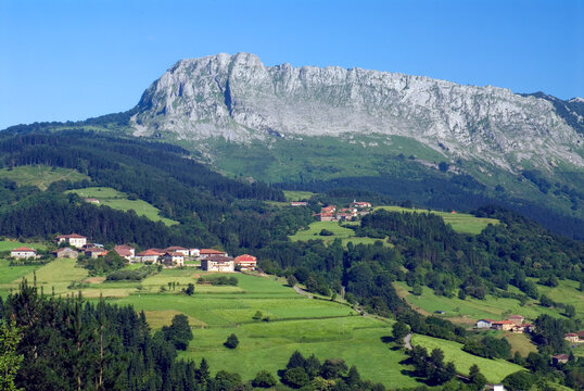Urigoiti neighborhood under the karstic massif of Itxina. Gorbeia Natural Park. Orozko. Basque Country. Spain