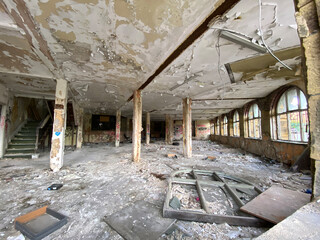 Interior, of a former weaving shed, in a derelict Victorian stone built mill, in the heart of post...