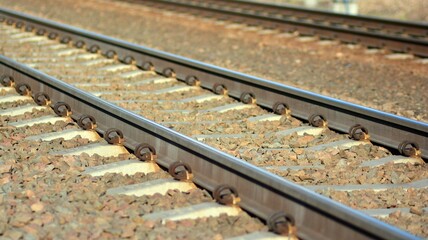Fototapeta premium Railway tracks in a rural scene in a sunny day.