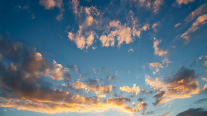evening sky with beautiful sunlit clouds as a natural background