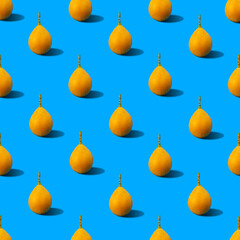 Colorful and summer time background pattern illustration of yellow fresh passion fruits (sweet granadilla) casting hard shadow on blue surface. Minimal summer food concept