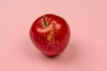 apple on a light background in the center with space