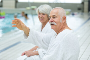 Fototapeta premium portrait of elderly couple waving