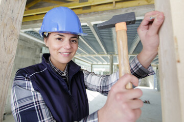 woman with hammer and nail