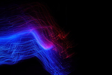 Red-blue light lines. Color light painting on a black background. Long exposure photography.