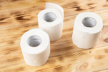 toilet paper on wooden background