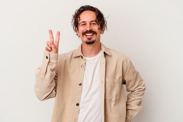 Young caucasian man isolated on white background showing number two with fingers.