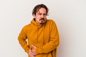 Young caucasian man isolated on white background having a liver pain, stomach ache.