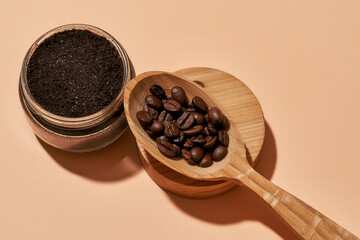 Facial scrub and wooden spoon with coffee