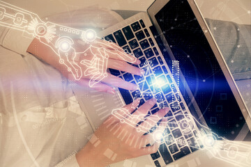 Double exposure of woman hands working on computer and data theme hologram drawing. Top View. Technology concept.