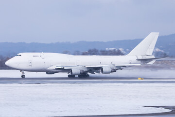 Widebody cargo aircraft departing in winter