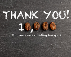 Thank you sign ten thousand followers on blackboard. Zero numbers replaced with coffee beans