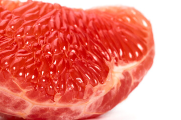 The pulp of a red grapefruit close-up. Closeup.