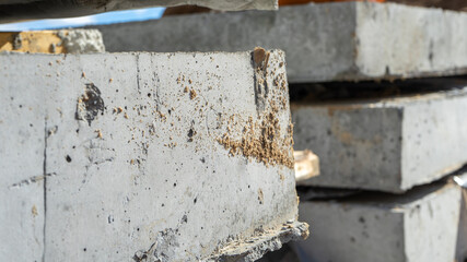 Close-up corner view of reinforced concrete slabs. Construction and manufacture of concrete slabs and floors.