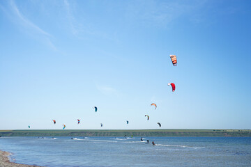 Kiteboarding competition, many kites in the sky, in southern Ukraine
