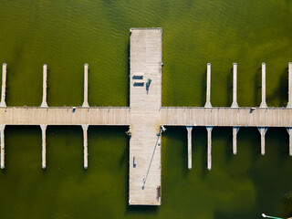 marina for boats, wooden footbridge, Masurian lakes. Aerial view, photos from the drone