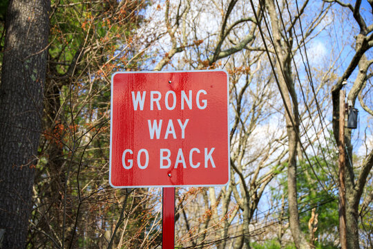 Red wrong way go back sign in the road