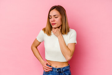 Young caucasian woman isolated on pink background suffers pain in throat due a virus or infection.