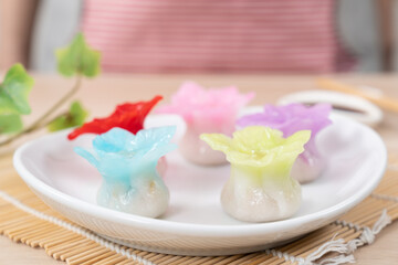 Fototapeta na wymiar Chinese style colorful flower dumplings or dim sum