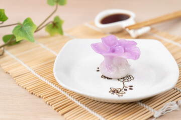 Fototapeta na wymiar Chinese purple color flower dumpling or dim sum