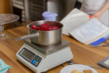 fruit jam is heated in a saucepan