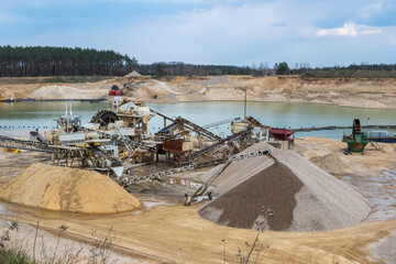 Fototapeta premium View of the production facility in the sand mine. Made on a sunny day.
