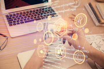 Multi exposure of technology drawing hologram and us dollars bills and man hands. Data concept