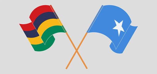 Crossed and waving flags of Mauritius and Somalia