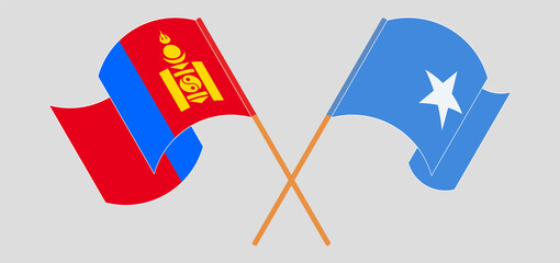 Crossed and waving flags of Mongolia and Somalia