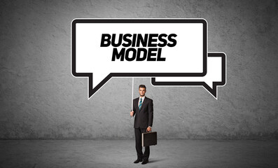 business person in casual holding road sign