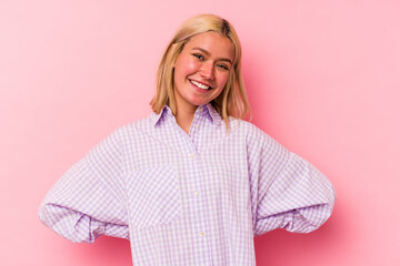 Obraz premium Young venezuelan woman isolated on pink background happy, smiling and cheerful.