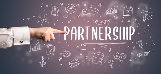 Close-Up of cropped hand pointing at business inscription