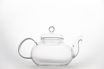 Transparent empty glass teapot isolated on white background