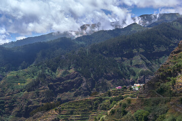 Fototapeta na wymiar mountain vastness, houses on top of the hill