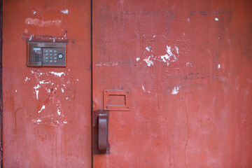 Old vintage intercom doorbell on apartment building doors