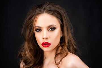 Closeup of woman makeup. Beautiful make-up with red lips, dark smokey eyes.
