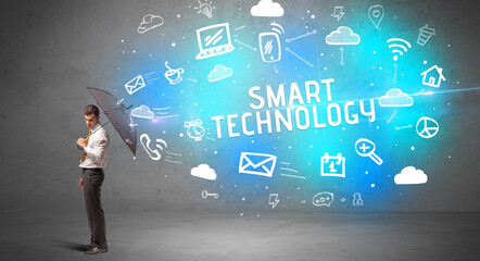 Businessman defending with umbrella, modern technology concept