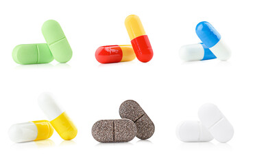set of different pills on white isolated background
