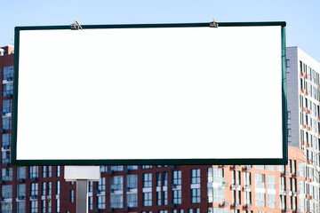 Blank empty billboard against new modern residential buildings