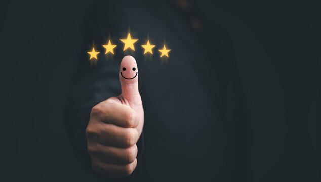 Customer Experience Satisfaction Concept. Hand Of Client With Thumb Up Positive Emotion Smiley Face Icon And Five Star With Copy Space.