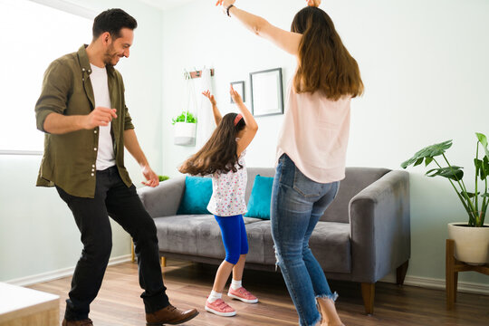 Young Latin Family Listening To Fun Music