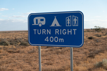 Camping area information road sign in rural Australian countryside