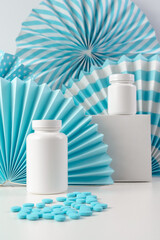 Jars of pills on a blue background. Concept photo. Place for the text. Blue pills. Vitamins for a healthy lifestyle
