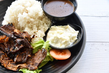 Grill Lamb with Rice and gravy on the plate